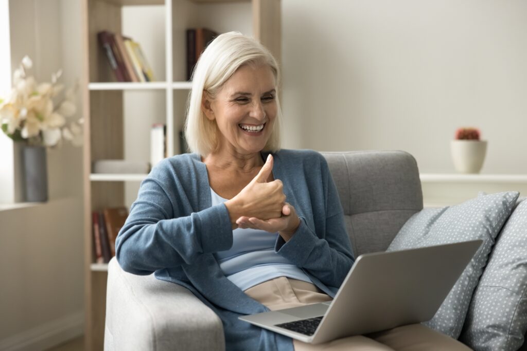 woman with thumbs up for improved mental health